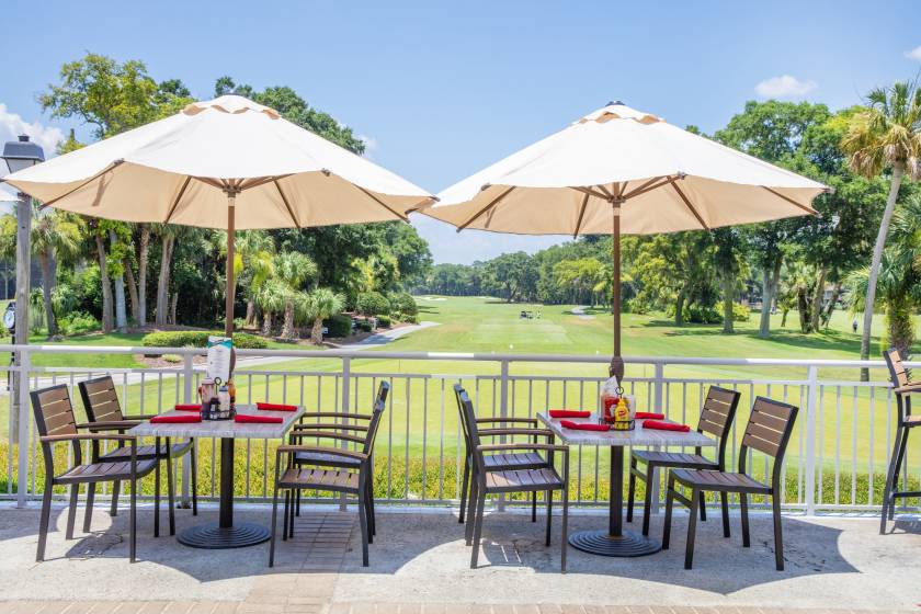 tables on the deck of Big Jim's overlooking the golf course